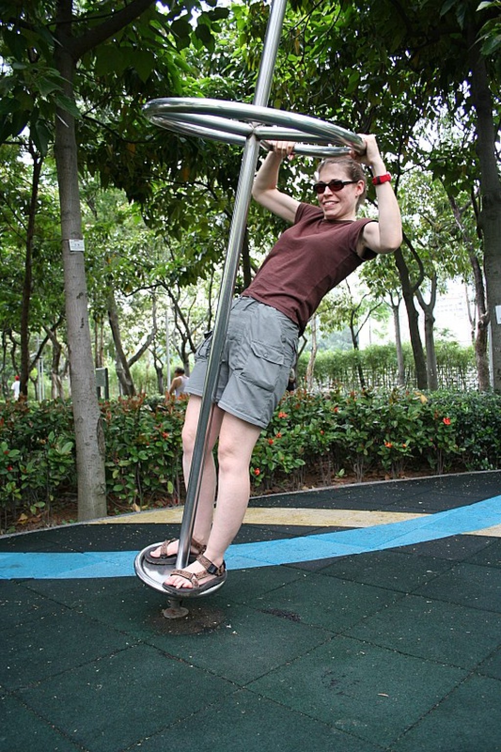 Wendy trying desperately to hold on.  Parks in Hong Kong and also the rest of China have this awesome playground equipment - for ADULTS!  The guy sitting on the bench behind us was trying SO hard not to giggle as we fooled around with all of it.